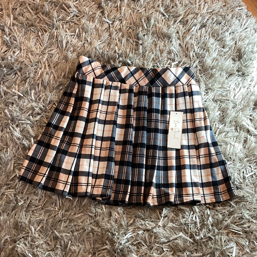 Cute pink and black plaid skirt.